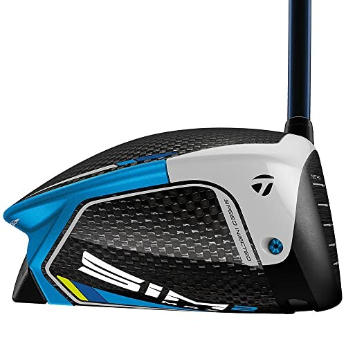 Close-up of a golf club driver head with carbon fiber design.