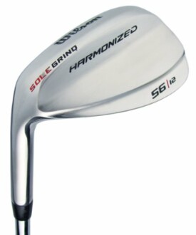 Harmonized golf club wedge with sole grind design.