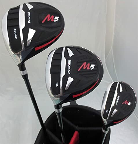 Set of three golf clubs in a bag